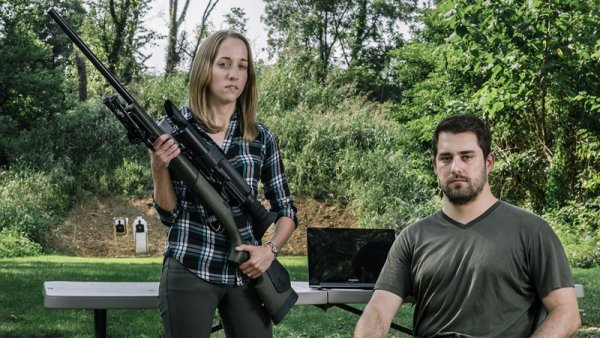 Security researchers Runa Sandvik, left, and husband, Michael Auger, right, have figured out how to hack into a Tracking Point TP750 rifle to control the trajectory of the bullets fired.