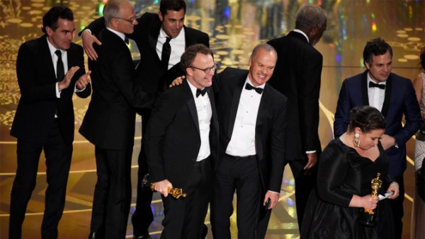 Tom McCarthy, center left, and Michael Keaton, center right, accept the award for best picture for "Spotlight" at the Oscars on Sunday, Feb. 28, 2016, at the Dolby Theatre in Los Angeles. (Photo by Chris Pizzello/Invision/AP)