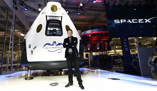 HAWTHORNE-CA-MAY 29: SpaceX CEO Elon Musk unveils the company's new manned spacecraft, The Dragon V2, designed to carry astronauts into space during a news conference on May 29, 2014, in Hawthorne, California. The private spaceflight company has been flying unmanned capsules to the Space Station delivering cargo for the past two years. The Dragon V2 manned spacecraft will ferry up to seven astronauts to low-Earth orbit. (Photo by Kevork Djansezian/Getty Images)