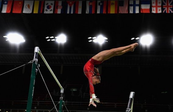 RIO DE JANEIRO, BRAZIL - AUGUST 04: Madison Kocian of USA practices on the uneven bars during Artistic Gymnastics training session at Rio Olympic Arena on August 4, 2016 in Rio de Janeiro, Brazil.  (Photo by Laurence Griffiths/Getty Images)