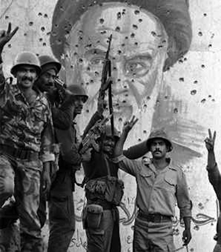 iraqi-soldiers-celebrate-after-recapturing-the-faw-peninsula-in-iraq-during-the-iran-iraq-war-behind-them-is-a-bullet-ridden-portrait-of-iranian-leader-ayatollah-ruhollah-khomeini