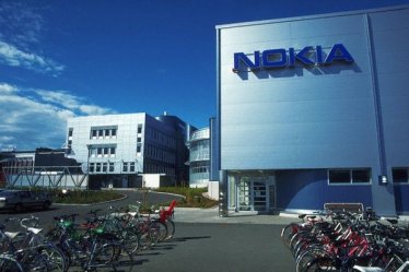ca. 1990s, Finland --- Bikes Parked Outside Nokia Corporation Buildings --- Image by © Joel W. Rogers/CORBIS