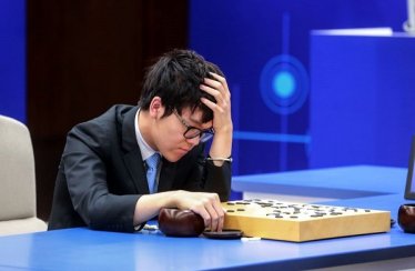 China's 19-year-old Go player Ke Jie reacts during the second match against Google's artificial intelligence programme AlphaGo in Wuzhen, eastern China's Zhejiang province on May 25, 2017. 
Chinese netizens fumed on May 25 over a government ban on live coverage of Google algorithm AlphaGo's battle with the world's top Go player, as the programme clinched their three-match series in the ancient board game. / AFP PHOTO / STR / China OUT        (Photo credit should read STR/AFP/Getty Images)