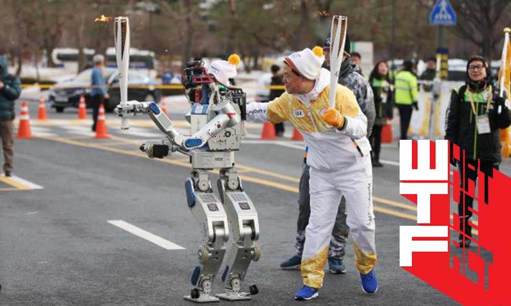 Hubo เมื่อหุ่นยนต์วิ่งคบเพลิงแทนมนุษย์ ในงานแข่งขันกีฬาของมวลมนุษยชาติ?