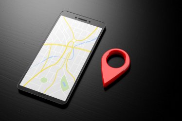 Navigation with a smartphone. Map on a smartphone screen and red location symbol on a black background, banner, copy space. 3d illustration