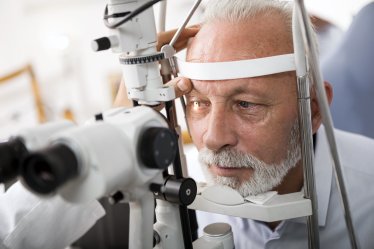 Doctor Checking Patient's Eyes