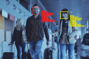 Facial Recognition System at the Airport. People carrying luggage.