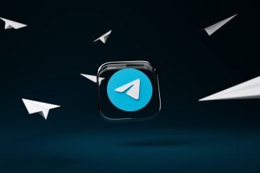 Telegram Application Icon in a black background, the paper plane flying through in the image represents Telegram app users