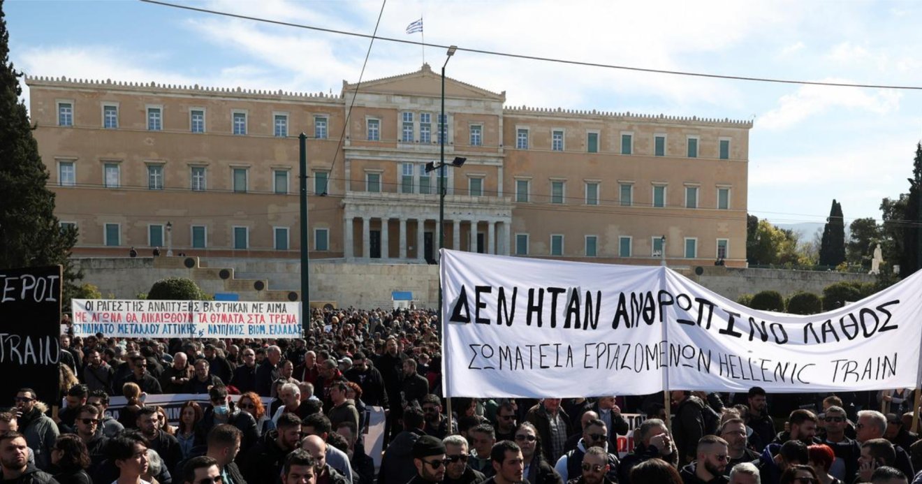 Protesters held black balloons to symbolize those killed in the crash