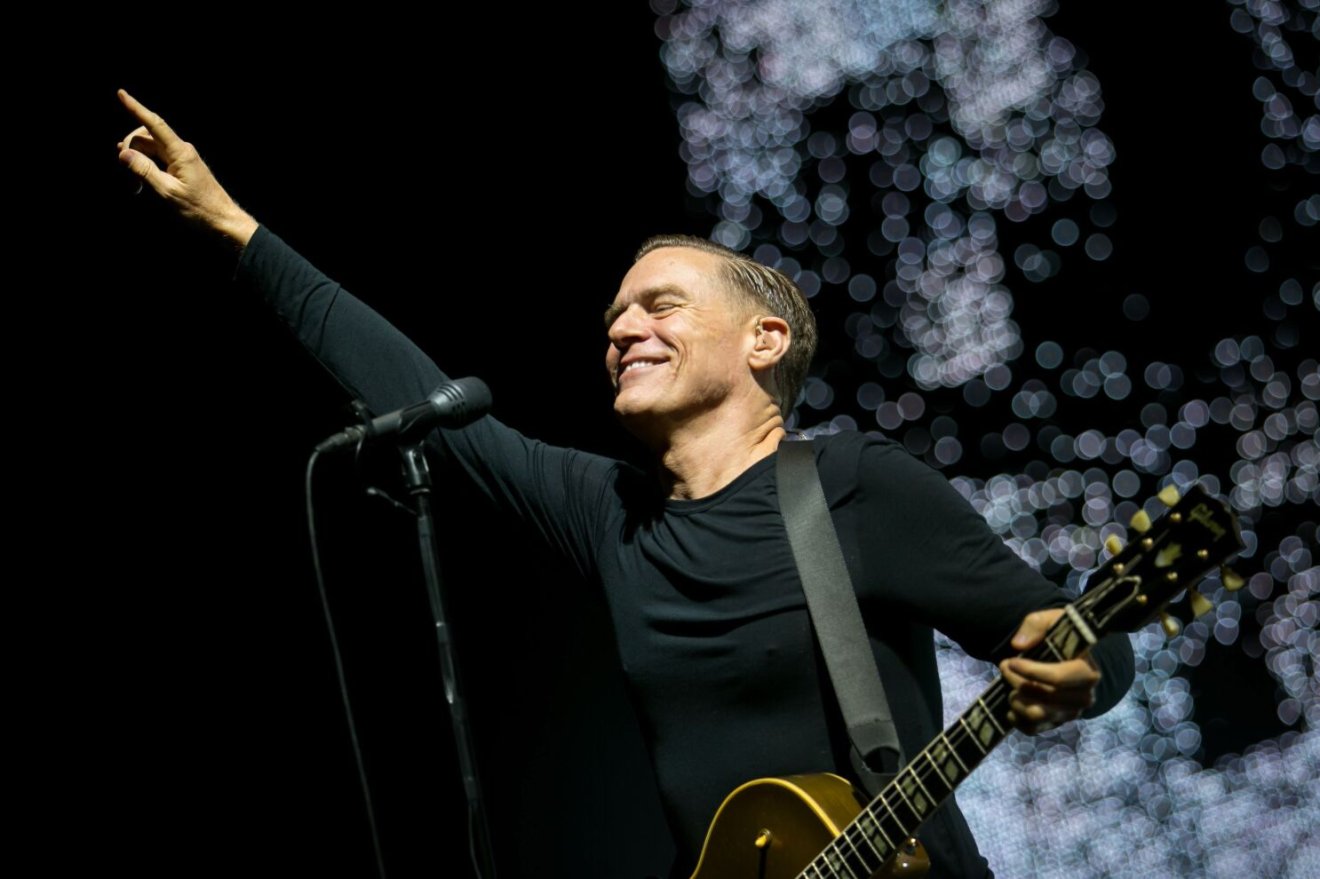 Canadian rock singer, songwriter and guitarist Bryan Adams performs during his concert in Papp Laszlo Budapest Sports arena in Budapest, Hungary, Sunday night, July 29, 2012. (AP Photo/MTI, Balazs Mohai)