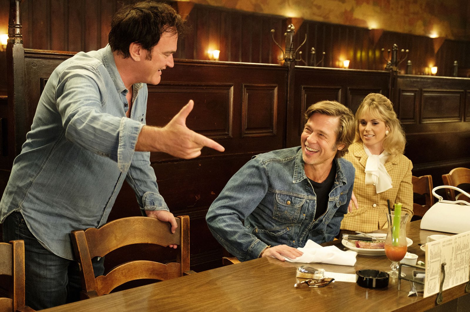 Brad Pitt, Quentin Tarantino, and Elise Nygaard Olson in Once Upon a Time in... Hollywood