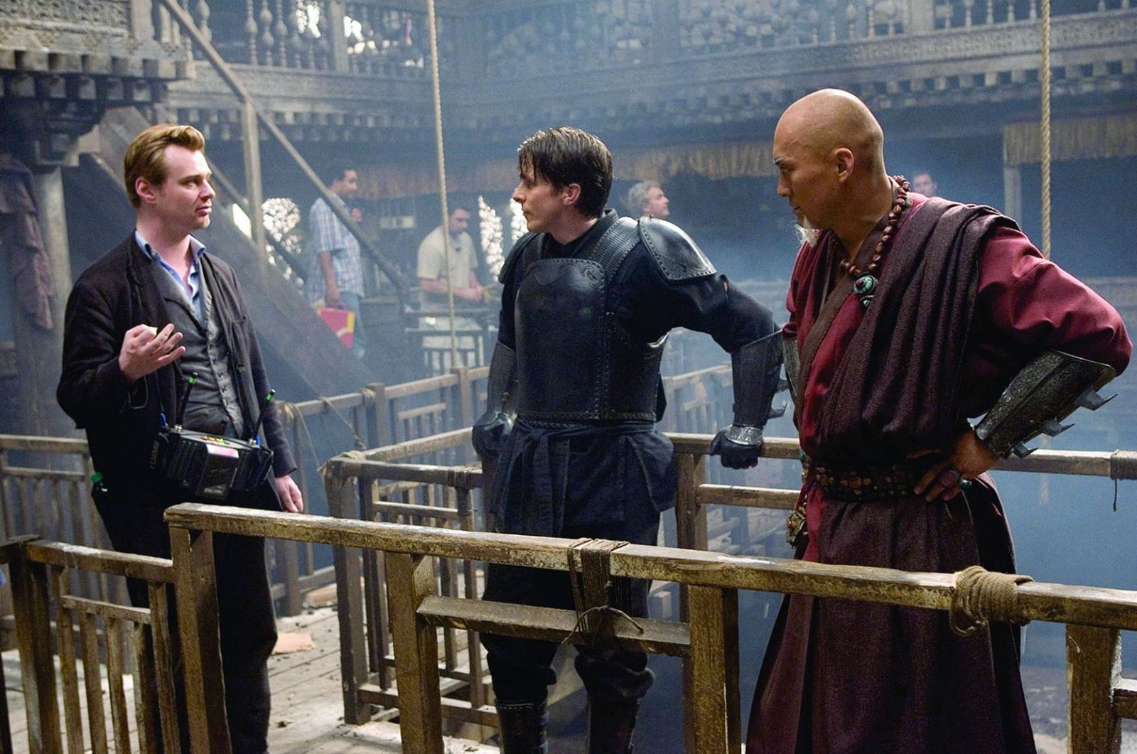 Christian Bale, Christopher Nolan, and Ken Watanabe in Batman Begins (2005)