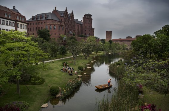 DONGGUAN, CHINA - APRIL 12: A worker cleans a waterway as office buildings are seen at Huawei's new sprawling 'Ox Horn' Research and Development campus on April 12, 2019 in Dongguan, near Shenzhen, China. Huawei is Chinas most valuable technology brand, and sells more telecommunications equipment than any other company in the world, with annual revenue topping $100 billion U.S.  Headquartered in the southern city of Shenzhen, considered Chinas Silicon Valley, Huawei has more than 180,000 employees worldwide, with nearly half of them engaged in research and development. In 2018, the company overtook Apple Inc. as the second largest manufacturer of smartphones in the world behind Samsung Electronics, a milestone that has made Huawei a source of national pride in China.
While commercially successful and a dominant player in 5G, or fifth-generation networking technology, Huawei has faced political headwinds and allegations that its equipment includes so-called backdoors that the U.S. government perceives as a national security. U.S. authorities are also seeking the extradition of Huaweis Chief Financial Officer, Meng Wanzhou, to stand trial in the U.S. on fraud charges. Meng is currently under house arrest in Canada, though Huawei maintains the U.S. case against her is purely political. Despite the U.S. campaign against the company, Huawei is determined to lead the global charge toward adopting 5G wireless networks.  It has hired experts from foreign rivals, and invested heavily in R&D to patent key technologies to boost Chinese influence.(Photo by Kevin Frayer/Getty Images)