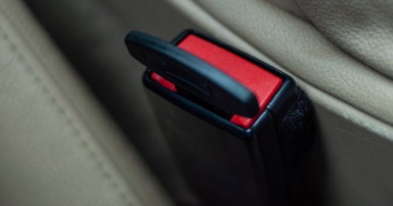 A plastic plug inserted in the connector for the car seat belt to reject the sensor signal. Violation of safety rules and road traffic. Unjustified risk.