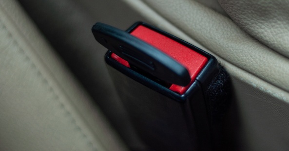 A plastic plug inserted in the connector for the car seat belt to reject the sensor signal. Violation of safety rules and road traffic. Unjustified risk.